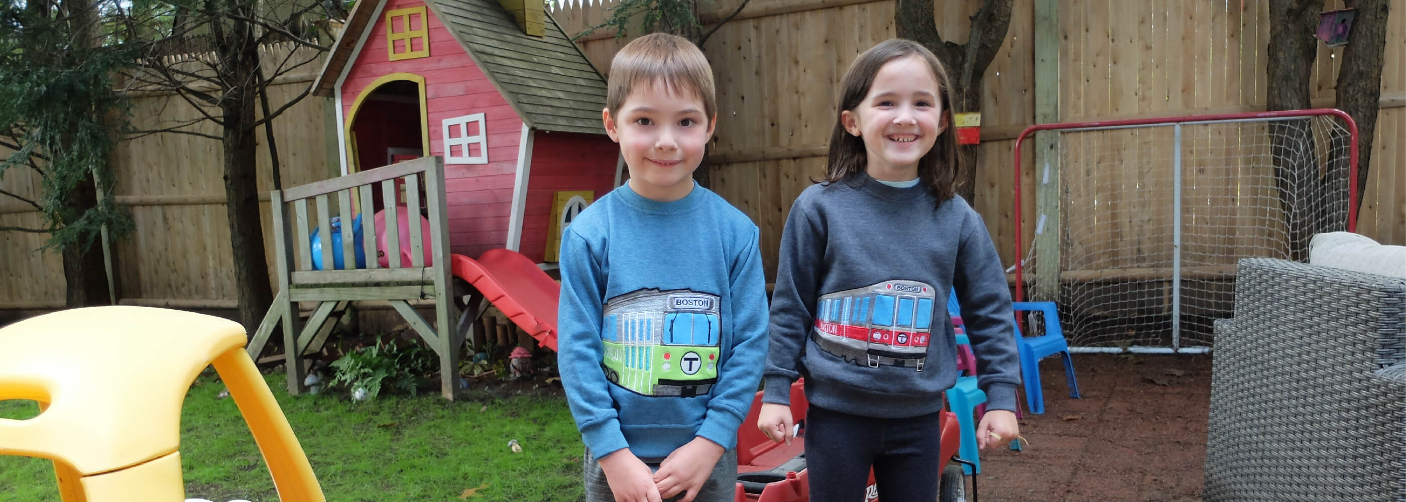 Toddler boy and girl wearing Boston MBTA Subway Train applique sweatshirts